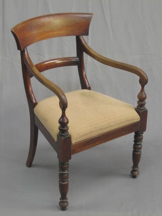 A 19th Century mahogany open arm carver/desk chair with plain mid rail and upholstered drop in seat, raised on turned supports