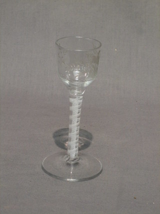 A 18th Century glass, the bowl engraved a bird amidst branches and with cotton twist stem