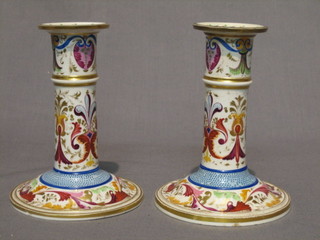 A pair of 18th Century Derby porcelain candlesticks with gilt and floral decoration, the base with Derby mark 44, 5"