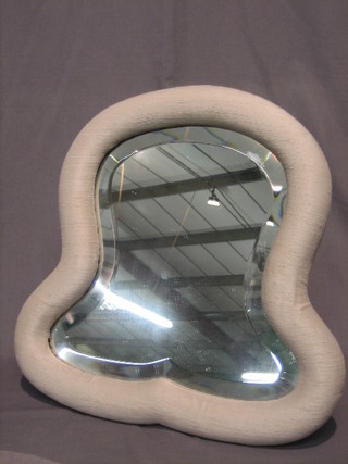 A Victorian shaped plate easel mirror, contained in a fabric covered frame 17"