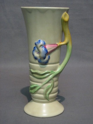 A Clarice Cliff vase with applied floral handle, the base marked Clarice Cliff 405, 9"