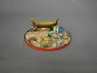 A Wade figure of a longboat, do. ashtray decorated a bird, do. trough in the form of a log 5" (chipped). a Wade Whimsey figure of a dog, boxed, 3 Wade figures of tortoises (f), 9 Wade figures and 1 other figure