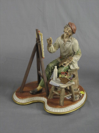 A Capo di Monte figure of a seated artist 13"