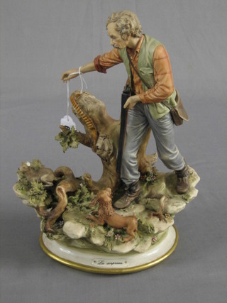 A Capo di Monte figure of a standing man with gun, dog and hare (hare ears f) 14"