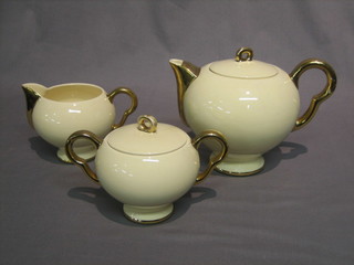 An Art Deco French 3 piece pottery tea service comprising teapot, twin handled sucrier & cream jug