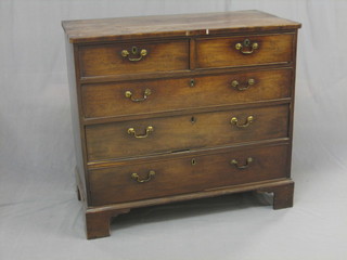 A 19th Century mahogany chest of 2 short and 3 long drawers with brass swan neck drop handles, raised on bracket feet 40" (split to top)