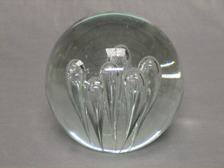 A large clear glass paperweight 7"
