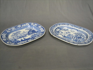 A 19th Century blue and white meat plate decorated a rural scene with river and bridge 18" (f and r) and 1 other