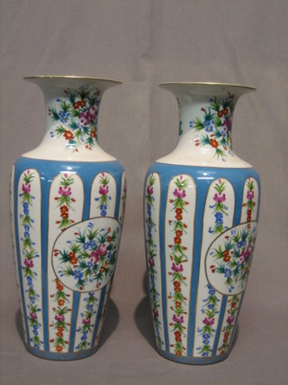 A pair of 20th Century Sevres style porcelain vases with green and gilt decoration 14"