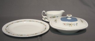 A 29 piece Royal Doulton Pastoral pattern dinner service comprising 2 12" oval tureens and covers, 2 oval meat plates 16 1/2" and 13", sauce tureen stand (chipped), 6 dinner plates 11", 6 breakfast plates 8", 6 tea plates 6 1/2" and 6 pudding bowls 5 1/2"