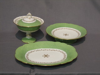 A 19th Century green and gilt banded dessert service comprising 4 oval dishes 11", a rectangular dish 11" (crack to base), 4 9" comports, 2 pedestal jars and covers 7" (cracked), 16 plates 9" (some rubbing to gilding), 2 plates 7" (1 f and r)