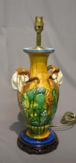 A Rococo style twin handled table lamp with rams horn decoration 14"