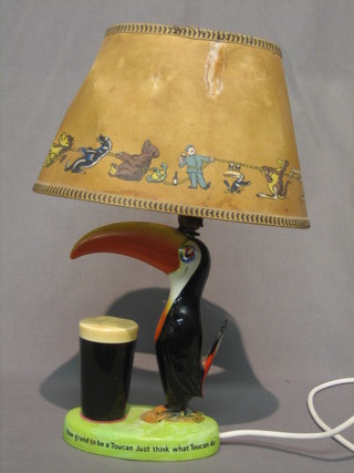 A Carltonware Toucan advertising lamp, base marked If He Can Say As You Can Guinness is Good For You and How Grand To Be a Toucan, Just Think What Toucan Do (base heavily f and r) complete with original shade