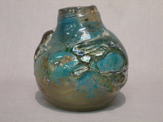 A green Art Glass vase of globular form and with swirl decoration