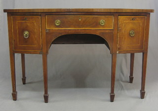 A 19th Century mahogany bow front sideboard, fitted 1 long drawer flanked by a pair of cupboards, raised on square tapering supports ending in spade feet, 54"