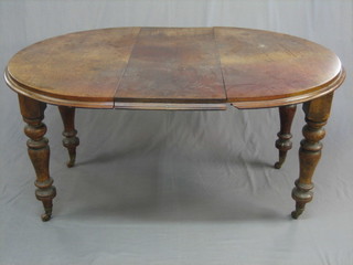A Victorian oval mahogany extending dining table, raised on turned supports 58"