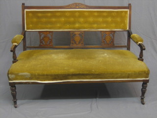 An Edwardian inlaid mahogany sofa upholstered in yellow buttoned material 47" wide