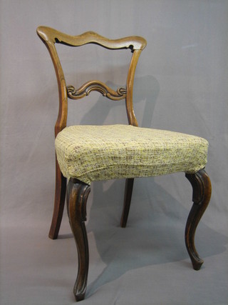 2 Victorian bleached rosewood spoon back chairs with carved mid rails and upholstered seats, raised on cabriole supports