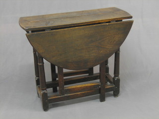 An 18th Century oak tea table, fitted a frieze drawer and raised on turned and block supports 30" (split to top)