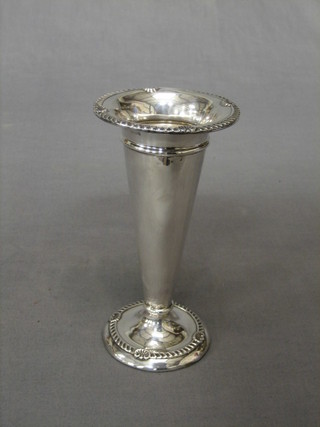 A silver trumpet shaped specimen vase with embossed border, raised on a circular spreading foot, Birmingham 1908 7"