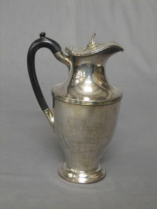 A silver plated hotwater jug with ebony handle, inscribed