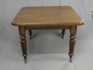 A Victorian mahogany extending dining table with 1 extra leaf raised on turned and reeded supports, 39"