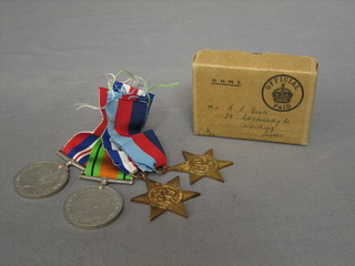 A group of 4 medals comprising 39/45 Star, France & German Star, Defence & War medal complete with original paper box