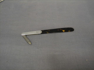 A silver and tortoiseshell paperknife with tortoiseshell blade and silver handle incorporating a folding pen knife, London 1916 5"