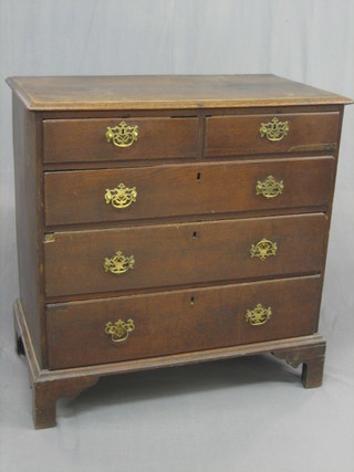 An 18th Century oak chest of 2 short and 3 long drawers, raised on bracket feet 37" 