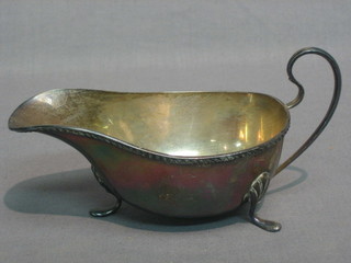 A Georgian style silver sauce boat with C scroll handle Birmingham 1925, 2 ozs