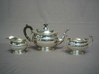 A Mappin & Webb Georgian style 3 piece silver tea service of oval form with swag decoration, London 1927, 36 ozs
