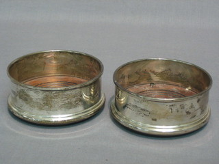 A pair of modern silver bottle coasters 4"