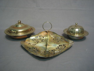 A square pierced silver plated 4 section sandwich stand and 2 silver plated muffin dishes and covers