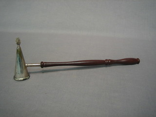 A modern silver candle snuffer with turned beech handle