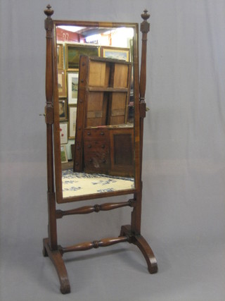 A Victorian rectangular cheval mirror contained in a mahogany swing frame