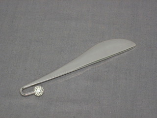 A modern silver paper knife, the handle in the form of a golf ball