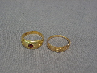 An 18ct gold dress ring and 1 other