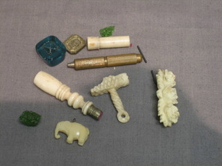 A miniature carved ivory hammer/gavel 1", an ivory seal 1 1/2", a glass seal etc (8)