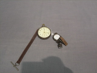 A silver open faced pocket watch and a lady's silver wristwatch