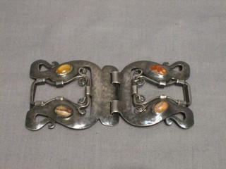 An Edwardian planished silver buckle, set 4 cabouchon cut hardstones by Liberty & Co, London 1902, the reverse marked Cymric