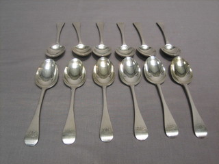 12 Victorian silver Old English pattern table spoons, London 1881, 19 ozs