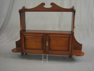 An Edwardian mahogany hanging cabinet enclosed by panelled doors 34"