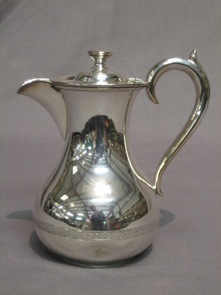 A silver plated hotwater jug