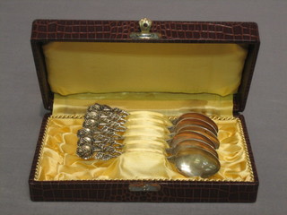 6 Continental silver coffee spoons, the handles in the form of roses, cased