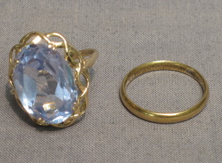 A 9ct gold wedding band and 1 other ring set a blue stone (2)