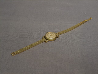 A lady's gold cased watch by The International Watch Company