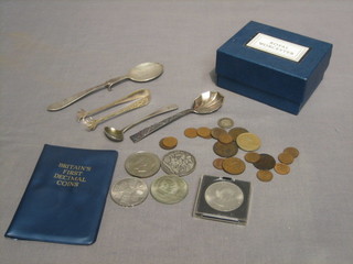 A small collection of various coins, a silver jam spoon, a silver fruit spoon, a Georgian mustard spoon, a pair of tongs and an egg coddler