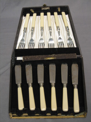 A set of 6 silver plated fish knives and forks