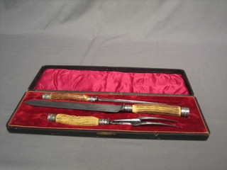 A Victorian 3 piece carving set with stag horn handles, cased