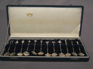 12 various Oriental silver teaspoons, cased